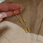 Aretes de Titanio con Detalle de Gotitas de Agua