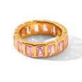 Anillo de Acero con Zirconias Rosadas en Canal Dorado