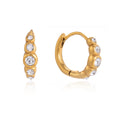 Huggies de Acero con Zirconias en Bezel Dorado