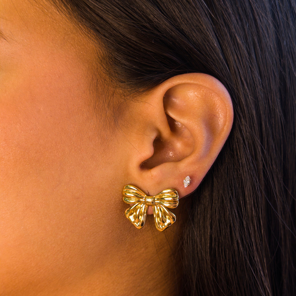 Aretes de Acero con Moño Acanalado Dorado