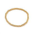 Pulsera de Acero con Cuentas Doradas